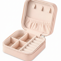Pink travel jewellery organiser open showing compartments